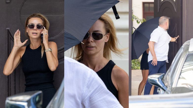 Izabela Janachowska zasłania się parasolem w drodze do samochodu