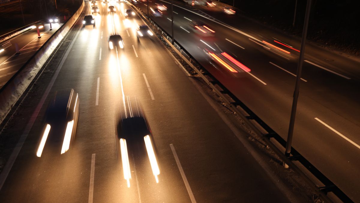 BERLIN, GERMANY - FEBRUARY 15: Cars drive in fast traffic along a highway at twilight on February 15, 2022 in Berlin, Germany. Germany's transition to electric cars is accelerating.  (Photo by Sean Gallup/Getty Images)