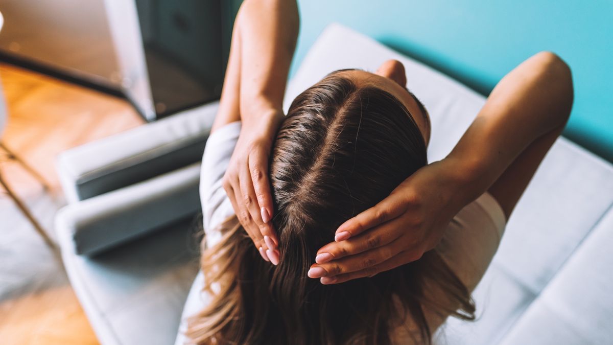 Young brunette woman showing her hair, hair roots, hair loss or dry scalp
Young brunette woman showing her hair, hair roots, color, grey hair, hair loss or dry scalp problem. . High quality photo
nikkimeel