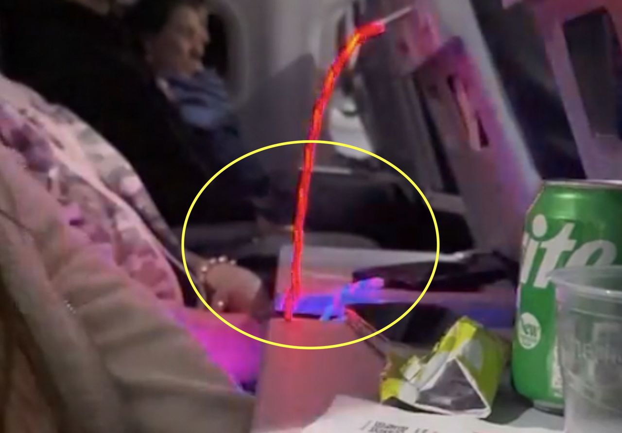 The traveler used a glowing charger during the six-hour flight.