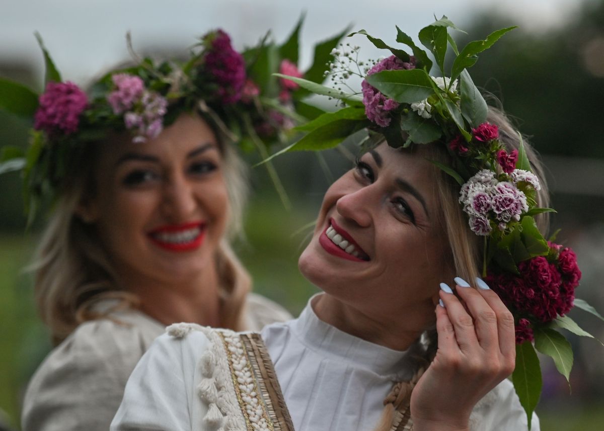 Two young women in a flower wreaths during the Kupala Night celebrations, the Slavic summer solstice festival, at Lisia Gora nature reserve in Rzeszow.
On Tuesday, June 21, 2022, in Rzeszow, Podkarpackie Voivodeship, Poland. (Photo by Artur Widak/NurPhoto via Getty Images)