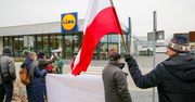 Protesty przed sklepami Lidla. "Gietrzwałd dla pielgrzymów, a nie dla magazynów"