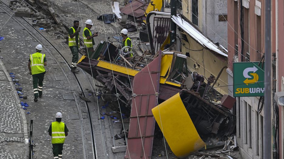 LISBON, PORTUGAL - SEPTEMBER 04: Carris personnel inspect the wrecked Gloria funicular on September 04, 2025 in Lisbon, Portugal. Seventeen people were killed and around 20 injured when a car on the Glória Funicular derailed in Lisbon. The iconic funicular railway line, also called Elevador da Glória, connects Lisbon's Restauradores Square to the neighborhood of Bairro Alto via a steep 275 meter (900ft) climb, and is popular among tourists. (Photo by Horacio Villalobos/Getty Images)