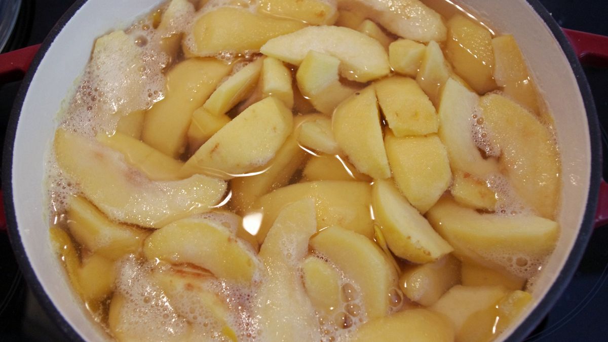 Chopped quince slices being brought to the boil in a large stock pot
Simon McGill