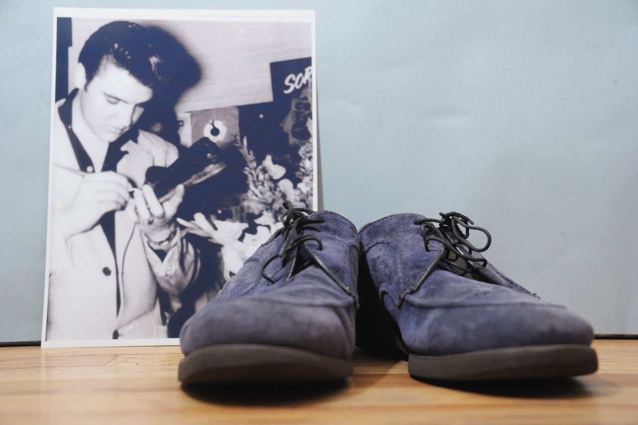 Elvis’s blue suede shoes fetch £120,000 at London auction
