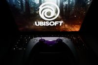 Ubisoft logo displayed on a laptop screen and DualSense controller are seen in this illustration photo taken in Krakow, Poland on October 23, 2024. (Photo by Jakub Porzycki/NurPhoto via Getty Images)