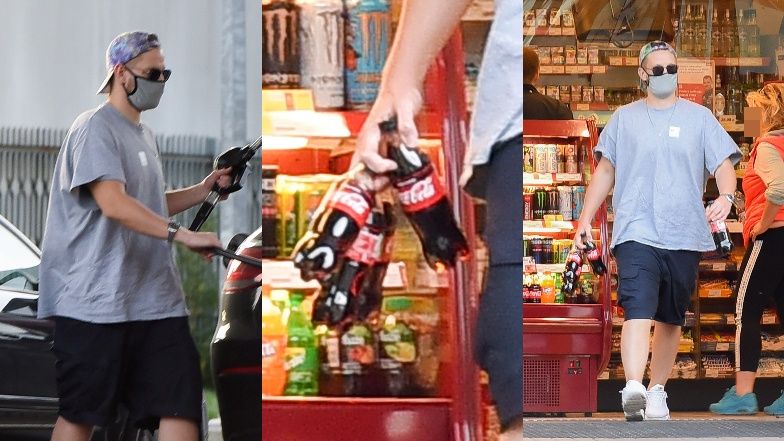 Sebastian Fabijański kupuje napój na stacji benzynowej