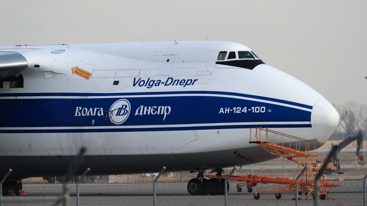 Livery for Volga-Dnepr Group on an Antonov An-124 strategic airlift cargo aircraft at Leipzig/Halle Airport in Schkeuditz, Germany, on Wednesday, March 2, 2022. Russia's invasion of Ukraine has sidelined a fleet of massive air freighters that oil companies and engineering firms rely on to carry oversize items such as helicopters, power turbines and are even used for spacecraft. Photographer: Krizstian Bocsi/Bloomberg via Getty Images