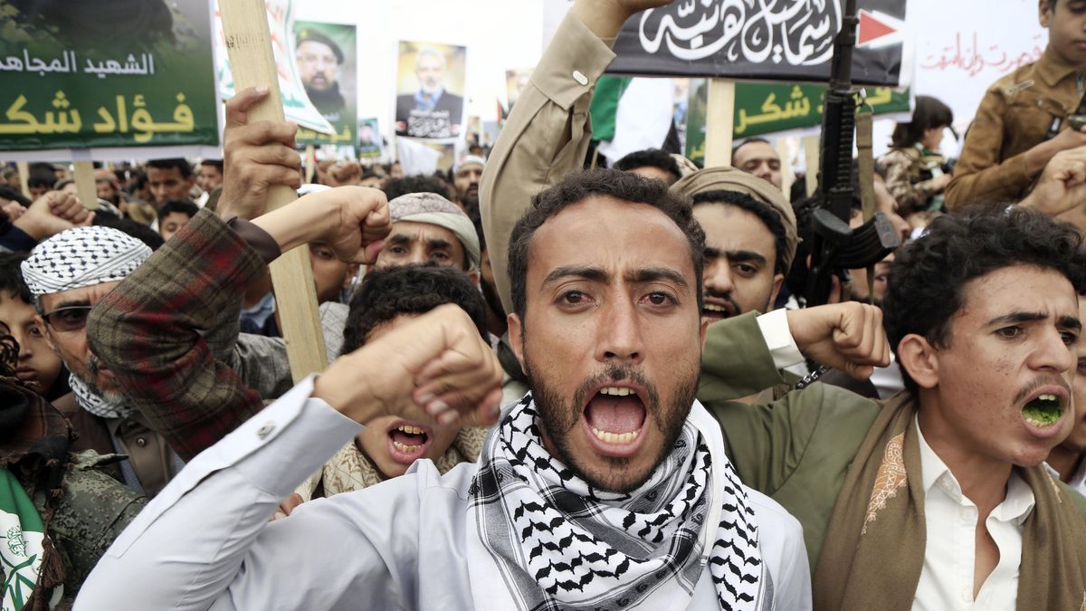 SANAA, YEMEN - AUGUST 2: Thousands of people protest the assassination of Hamas Political Bureau Chief Ismail Haniyeh in Iran, and Israel's attacks on the Gaza Strip in Yemen's capital, Sana'a on August 02, 2024. The demonstrators carried posters with the photos of Hamas' Political Bureau Chairman Haniyeh and senior Hezbollah commander Shukr. (Photo by Mohammed Hamoud/Anadolu via Getty Images)