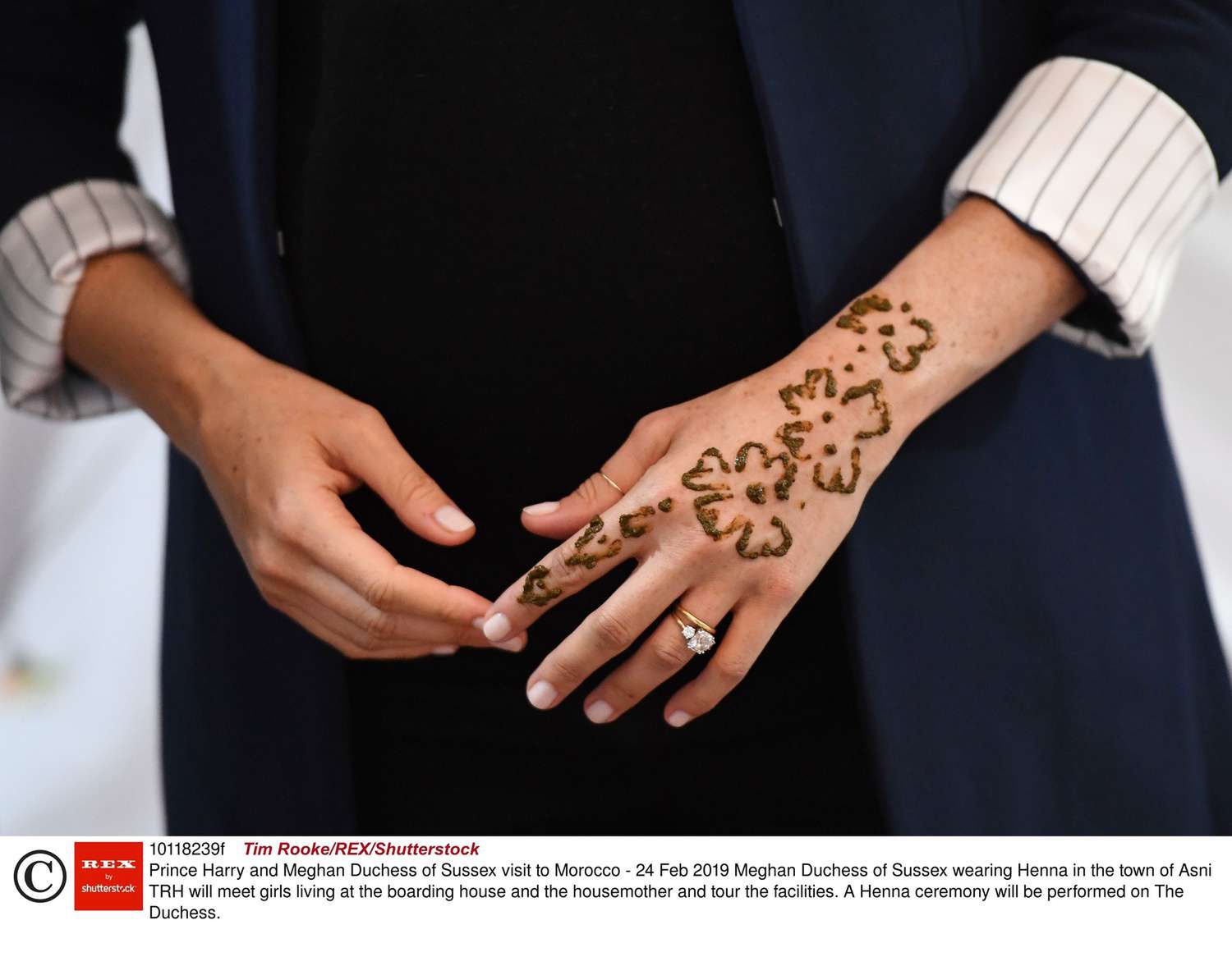 Mandatory Credit: Photo by Tim Rooke/REX/Shutterstock (10118239f)  Meghan Duchess of Sussex wearing Henna in the town of Asni  Prince Harry and Meghan Duchess of Sussex visit to Morocco - 24 Feb 2019  TRH will meet girls living at the boarding house and the housemother and tour the facilities. A Henna ceremony will be performed on The Duchess.