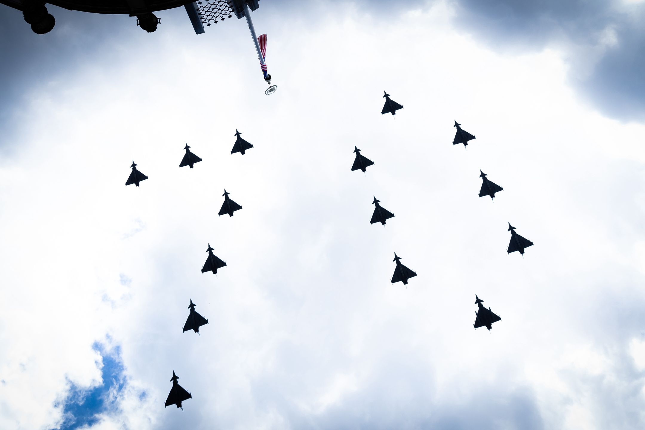 LONDON, UNITED KINGDOM - 2022/06/02: Eurofighter Typhoon aircraft perform a fly-past in the shape of the number 70 for Trooping the Colour during the celebration. Royal well wishers gather in Trafalgar Square to celebrate Trooping the Colour as part of the Queens Platinum Jubilee in London. (Photo by Tejas Sandhu/SOPA Images/LightRocket via Getty Images)