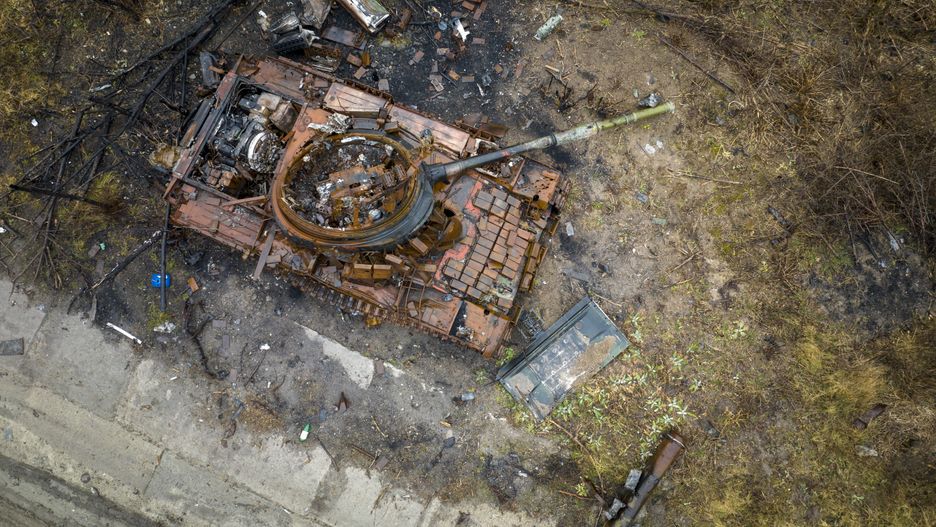 BOGORODYCHNE, UKRAINE - FEBRUARY 27: As seen from an aerial view, a destroyed Russian T-80 tank, its turret blown upside down, sits on a former frontline on February 27, 2023 in Bogorodychne, in the Donbas region of eastern Ukraine. The ruined town was the scene of intense fighting and was liberated by Ukrainian forces last fall. Last February, Russia's military invaded Ukraine from three sides and launched airstrikes across the country. Since then, Moscow has withdrawn from north and central parts of Ukraine, focusing its assault on the eastern Donbas region, where it had supported a separatist movement since 2014. (Photo by John Moore/Getty Images)