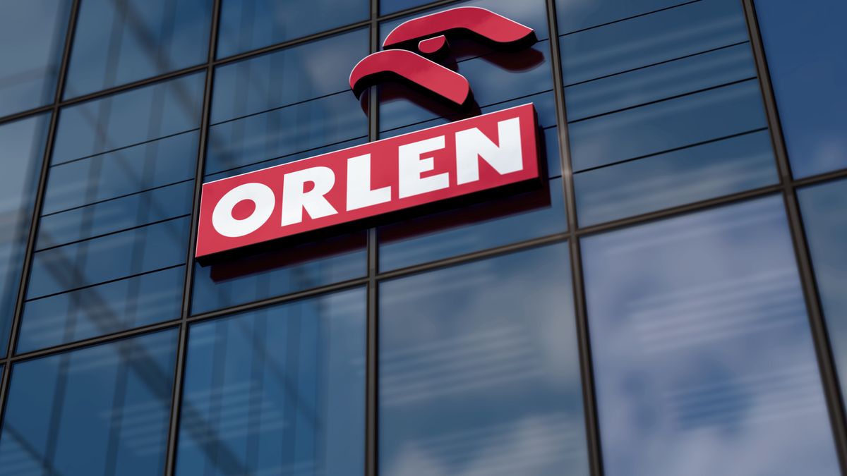 Plock, Poland, January 5, 2023: PKN Orlen headquarters glass building concept. Polish petrol oil gas and energy company symbol on front facade 3d illustration.ArekOrlen, oil, gas, Poland, Polish, PKN, fuel, PKN Orlen, glass building, office, glass, building, concept, company, refinery, petrol, business, industry, gasoline, oil company, logo, Plock, energy, hydrogen, city, facade, symbol, front, construction, cityscape, nobody, entrance, wall, blue, frame, sky, text, day, nobody, 3d, illustration, orlen, oil, gas, poland, polish, pkn, fuel, pkn orlen, glass building, office, glass, building, concept, company, refinery, petrol, business, industry, gasoline, oil company, logo, plock, energy, hydrogen, city, facade, symbol, front, construction, cityscape, nobody, entrance, wall, blue, frame, sky, text, day, 3d, illustration