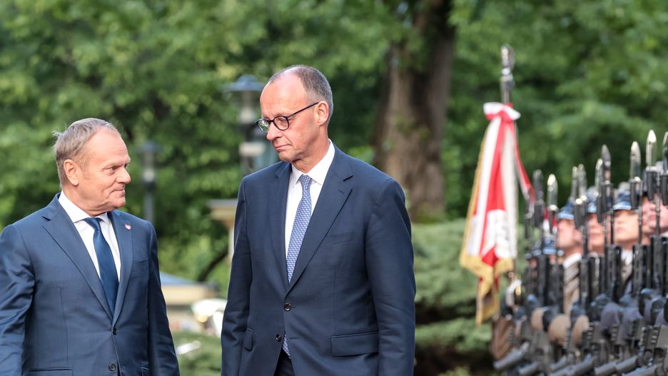 WARSAW, MAZOWIECKIE, POLAND - 2025/05/07: Polish Prime Minister Donald Tusk welcomes newly elected German Chancellor Friedrich Merz during his visit to Poland on the Chancellor's first day in office for a bilateral meeting at the Polish Prime Minister's Chancellery on Ujazdowska Street . The Chancellor is welcomed with full military ceremony. (Photo by Dominika Zarzycka/SOPA Images/LightRocket via Getty Images)