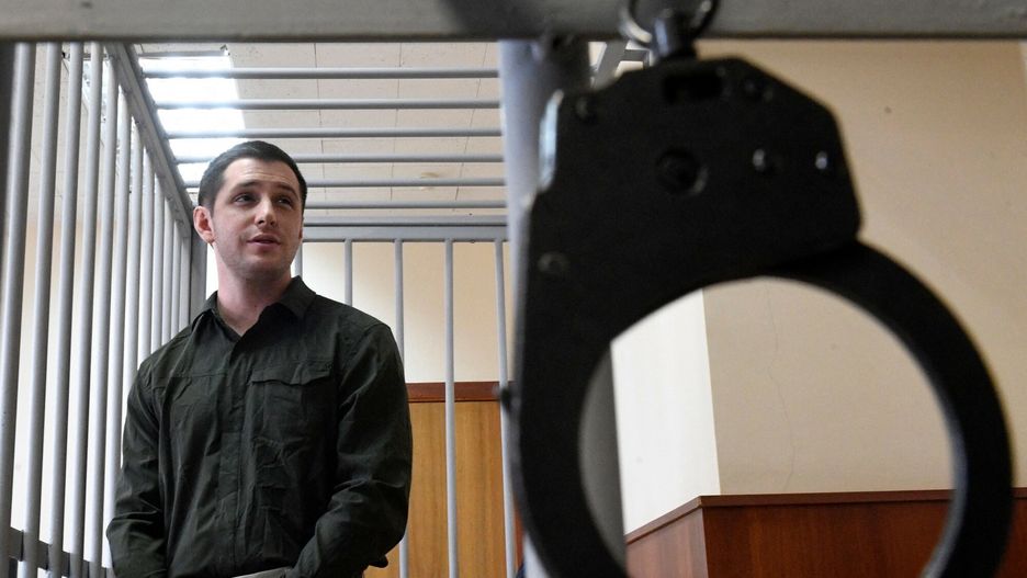 arch50(FILES) In this file photo taken on March 11, 2020 US ex-marine Trevor Reed, charged with attacking police, stands inside a defendants' cage during a court hearing in Moscow. - Moscow said on April 27, 2022 it has exchanged former US marine Trevor Reed, jailed in Russia for assaulting police, for Russian pilot Konstantin Yaroshenko, who was convicted of drug smuggling in the United States. (Photo by Alexander NEMENOV / AFP)ALEXANDER NEMENOV