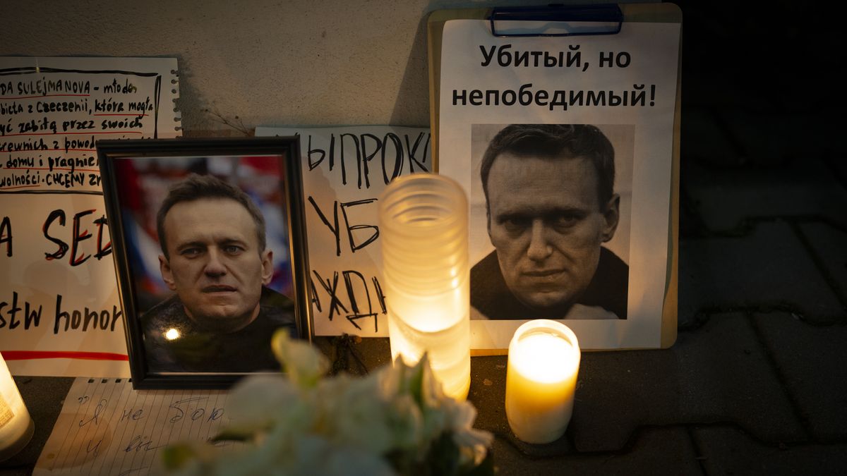 Photographs of the late political opposition activist and former presidential candidate Alexei Navalny are seen at a makeshift shrine with candles at the Russian embassy in Warsaw, Poland on 27 Februar, 2024. (Photo by Jaap Arriens/NurPhoto via Getty Images)