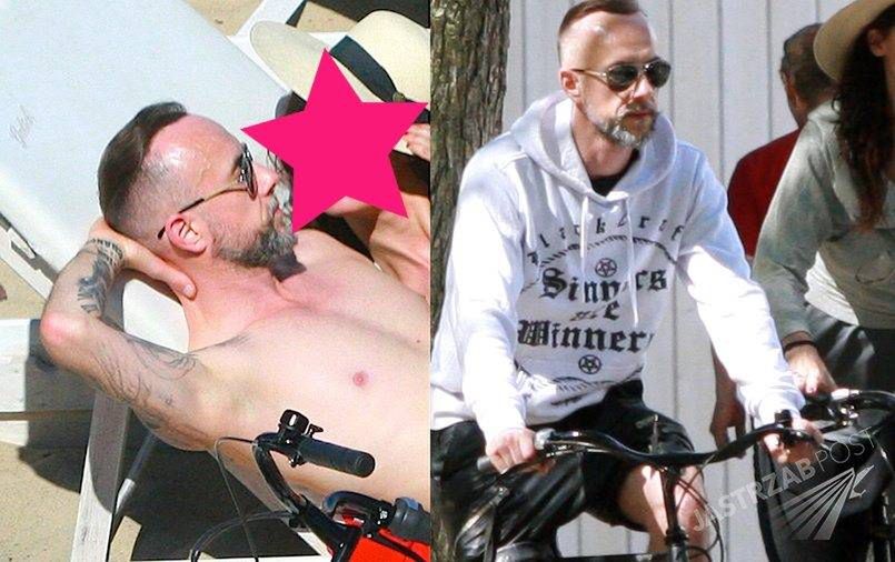 Nergal z piękną brunetką w Sopocie. Najpierw opalali się na plaży, a potem wybrali się na rowery [PAPARAZZI]