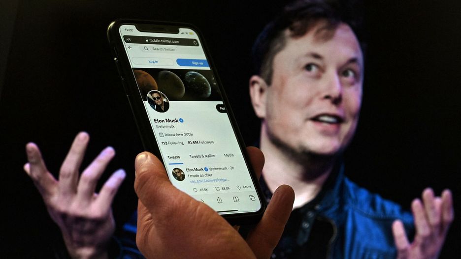 arch50
In this photo illustration, a phone screen displays the Twitter account of Elon Musk with a photo of him shown in the background, on April 14, 2022, in Washington, DC. - Tesla chief Elon Musk has launched a hostile takeover bid for Twitter, insisting it was a "best and final offer" and that he was the only person capable of unlocking the full potential of the platform. (Photo by Olivier DOULIERY / AFP)
OLIVIER DOULIERY
