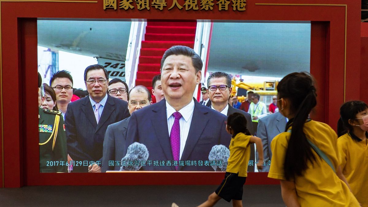HK Prepares For 25th Anniversary Of Handover
HONG KONG, CHINA - JUNE 23: Students walk in front of a television screen displaying the footage of Xi Jinping's previous visit at a handover exhibition ahead of the 25th anniversary of Hong Kong handover on June 23, 2022 in Hong Kong, China. Hong Kong will celebrate the 25th anniversary of its handover from Britain to China on July 1. (Photo by Anthony Kwan/Getty Images)
Anthony Kwan