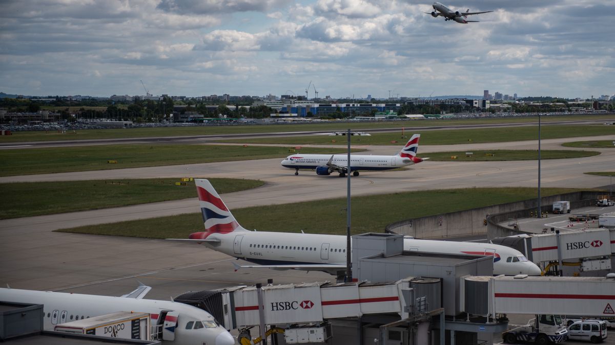 Passenger aircraft, operated by British Airways, a unit of International Consolidated Airlines Group SA (IAG), on the tarmac at London Heathrow Airport in London, UK, on Monday, June 13, 2022. Heathrow airport said its policy of carefully matching flight availability to resources as travel rebounds has been vindicated, citing a lack of disruption even as customer numbers reached their highest level since the start of the pandemic. Photographer: Chris J. Ratcliffe/Bloomberg via Getty Images