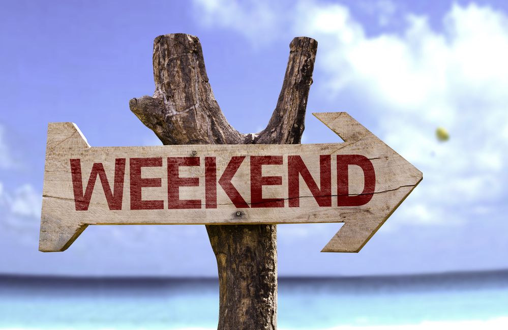 Weekend wooden sign with a beach