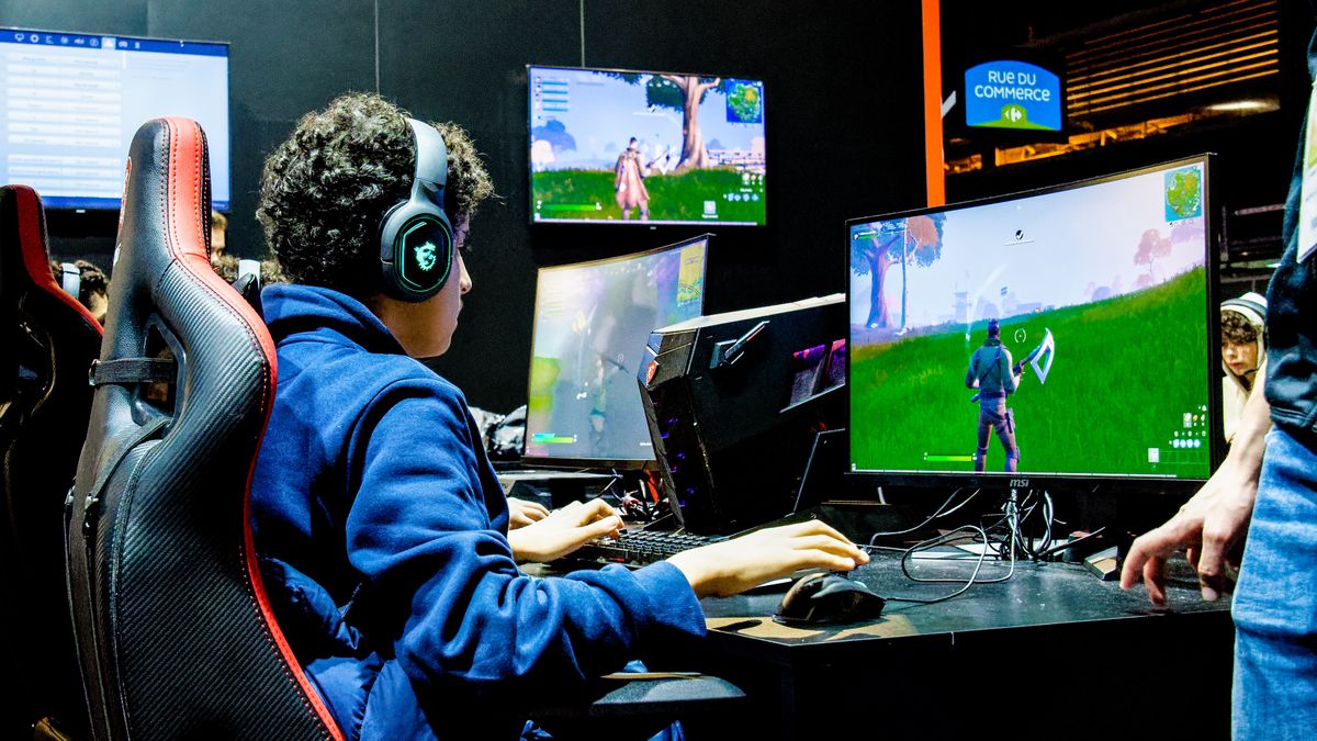 Gamers review Laptops, PCs, Graphic Card and Monitors of MSI brand at the Porte de Versailles exhibition center during the 10th edition of Paris Games Week 2019 fair - November 01, 2019, Paris. (Photo by Daniel Pier/NurPhoto via Getty Images)