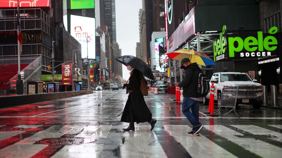 NEW YORK, USA - NOVEMBER 30: People cross a street during rain in New York, United States on November 30, 2020. (Photo by Tayfun Coskun/Anadolu Agency via Getty Images)