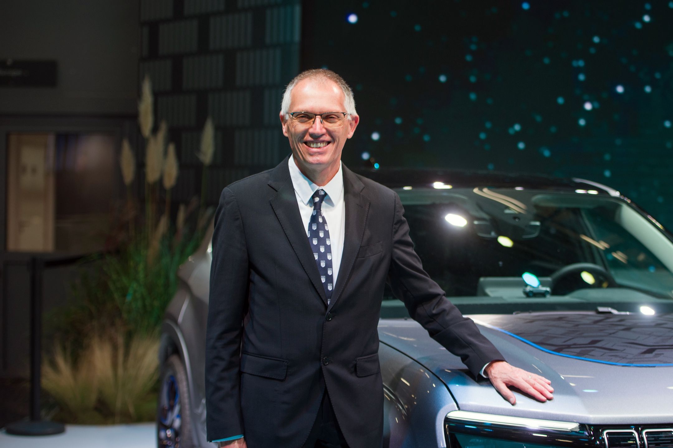 Carlos Tavares, chief executive officer of Stellantis NV, next to the all-electric Jeep Avenger SUV following a Bloomberg Television Interview during the opening day of the Paris Motor Show in Paris, France, on Monday, Oct. 17, 2022. The risk of Chinese manufacturers grabbing market share in Europe "is there," but it's "marginal" compared to what the European Union offered to the Chinese competition in terms of opening up the region's auto market, said Taveres. Photographer: Nathan Laine/Bloomberg via Getty Images