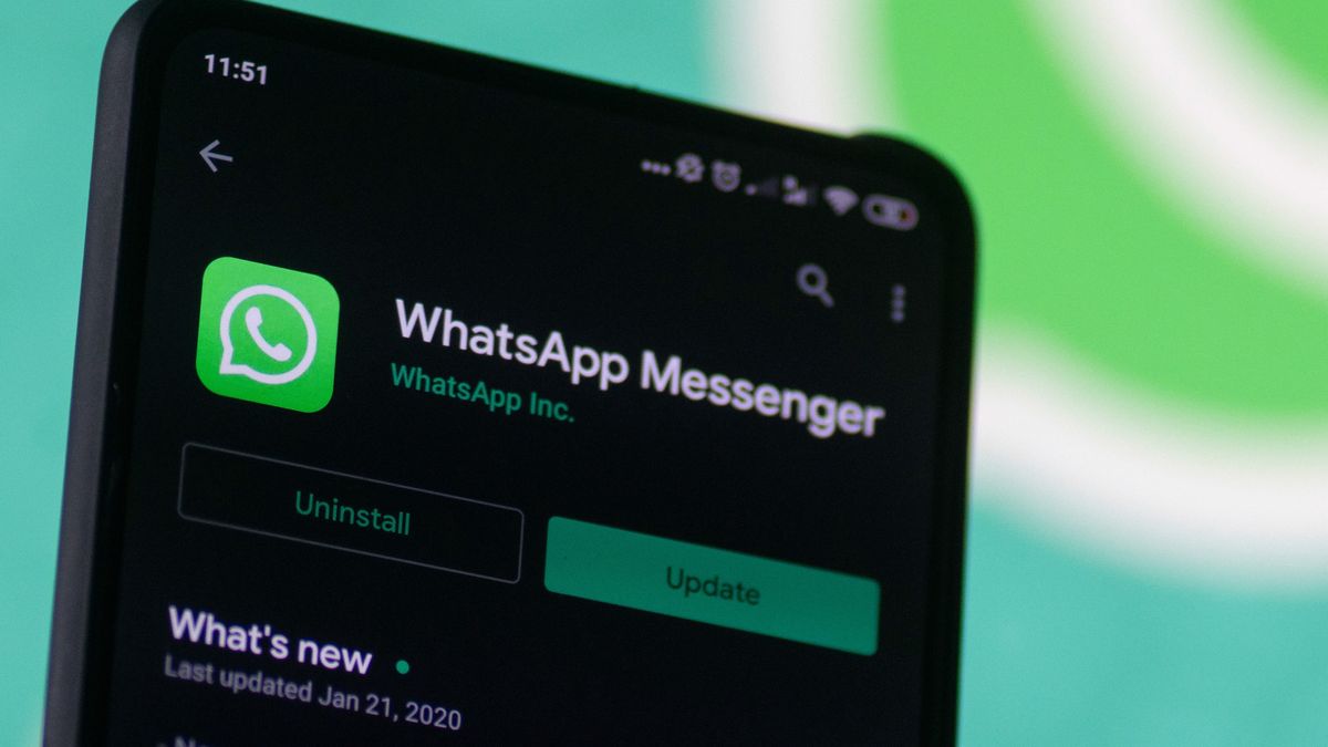 WhatsApp logo displayed on a phone screen, smartphone and keyboard are seen in this multiple exposure illustration. WhatsApp Messenger is a multiplatform mobile application that provides an encrypted instant messaging system belonging to Facebook, photo taken in Amsterdam, Netherlands on January 28, 2020 (Photo illustration by Nicolas Economou/NurPhoto via Getty Images)