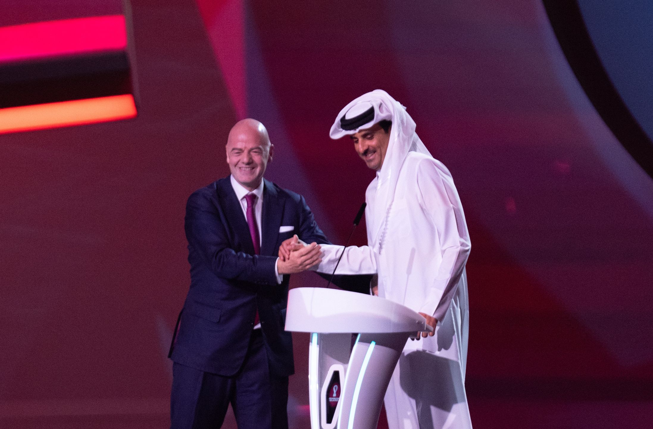 DOHA, QATAR - APRIL 01: Sheikh Tamim bin Hamad Al Thani, Amir of Qatar makes a speech watched on by Gianni Infantino, Fifa President during the FIFA World Cup Qatar 2022 Final Draw at the Doha Exhibition Center on April 01, 2022 in Doha, Qatar. (Photo by Tnani Badreddine/vi/DeFodi Images via Getty Images)