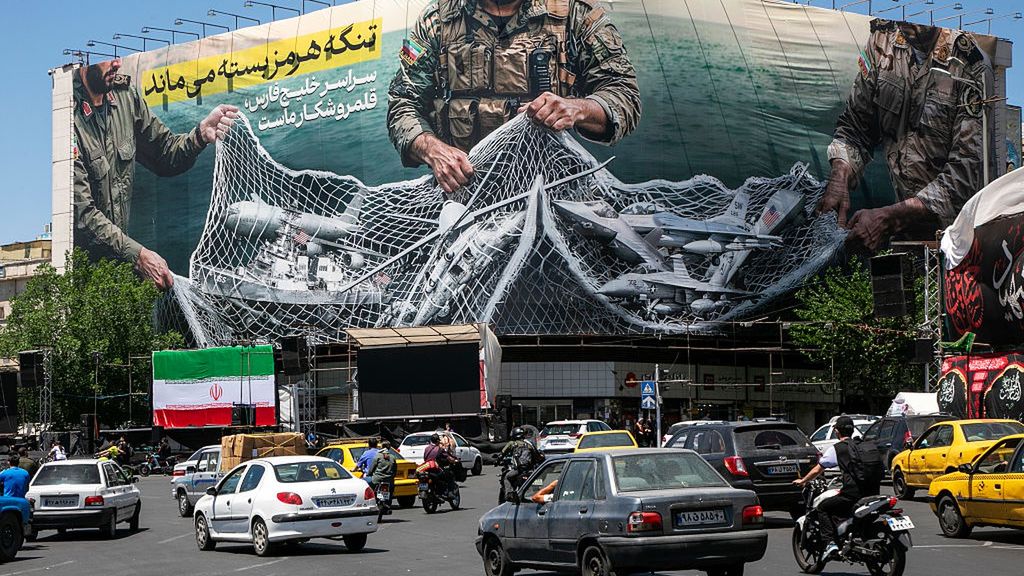 US-Iran Negotiations Show No Progress After Week Of Exchanging Fire
TEHRAN, IRAN - MAY 9: A poster depicts Iranian soldiers holding a net in the shape of the Strait of Hormuz, with US military aircraft ensnared in a fishing net, on May 9, 2026 in Tehran, Iran. There is little sign of progress in negotiations between Iran and the United States, despite both sides' insistence that their monthlong ceasefire is holding. (Photo by Majid Saeedi/Getty Images)
Majid Saeedi