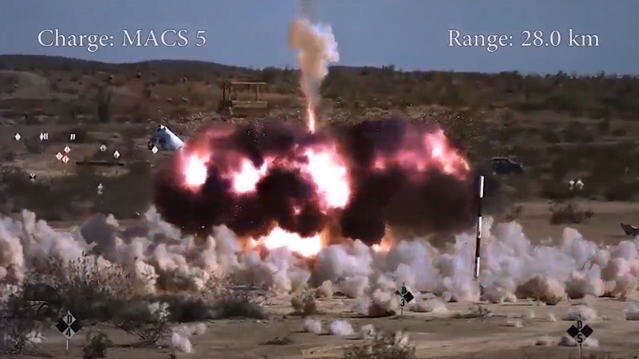 Test of a standard artillery shell with a proximity fuse during airburst. Dust clouds indicate the impact sites of fragments.