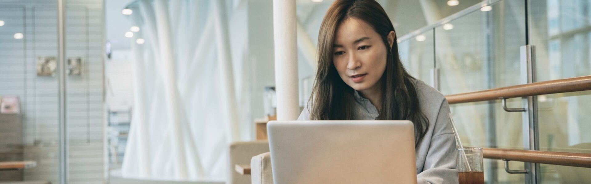 Asian woman working in cafe