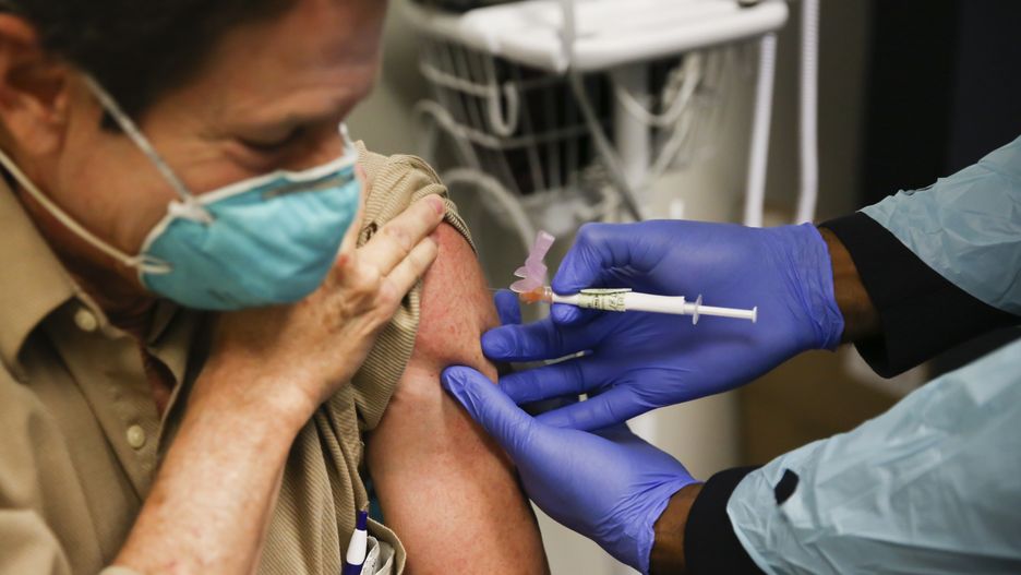 FLORIDA, USA - DECEMBER 18: Steve Brandwene, a healthcare worker, 64 years old, receives a Pfizer-BioNtech Covid-19 vaccine at Research Centers of America in Hollywood, Florida, United States on December 18, 2020. (Photo by Eva Marie Uzcategui Trinkl/Anadolu Agency via Getty Images)