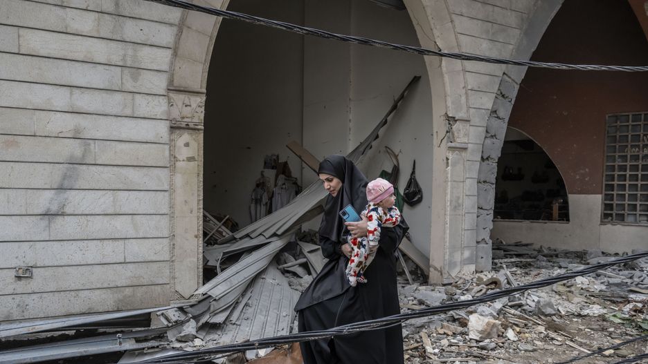 BEIRUT, LEBANON - NOVEMBER 28: Betoul Kassir, who lost her husband in the Israeli attacks, visits the house where she lives with her children, after returning to their homes following the ceasefire agreement between Lebanon and Israel in Dahiyeh district of the capital Beirut, Lebanon on November 28, 2024. Lebanese who returned to their homes after the ceasefire agreement, are shocked by the destruction in their neighborhoods. (Photo by Murat Sengul/Anadolu via Getty Images)