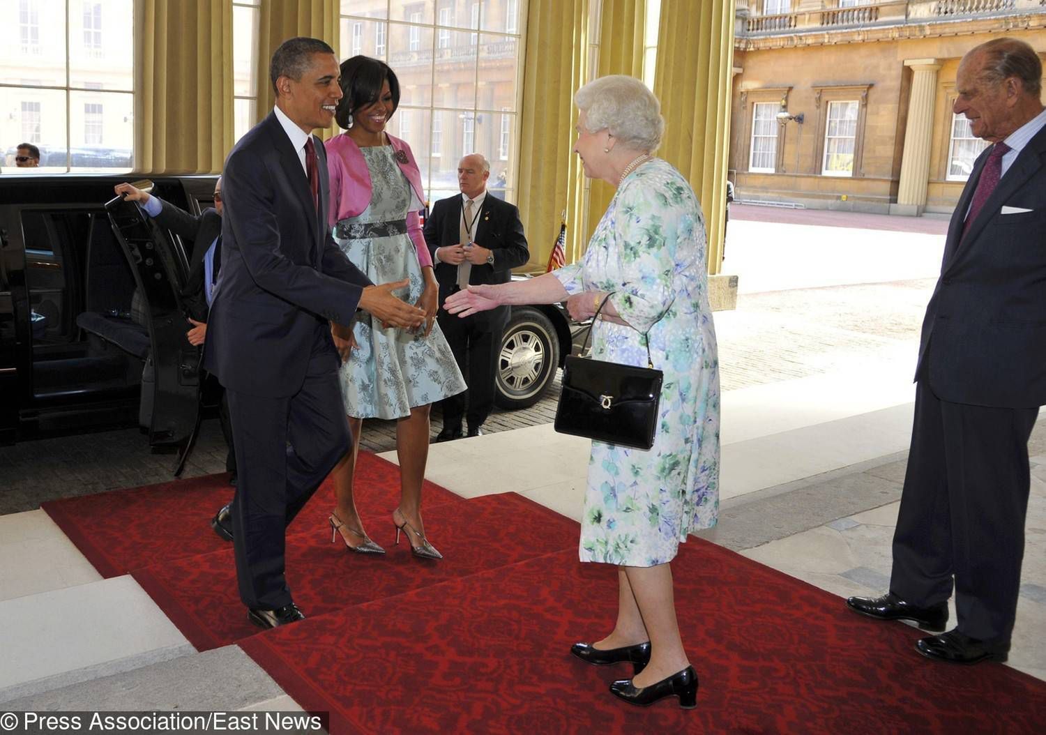 President of the United States Barack Obama (left) and first lady Michelle Obama (second left) are greeted by Queen Elizabeth II second right) and The Duke of Edinburgh as they arrive at Buckingham Palace, in central London, on the first day of President Obama's three-day state visit to the UK.