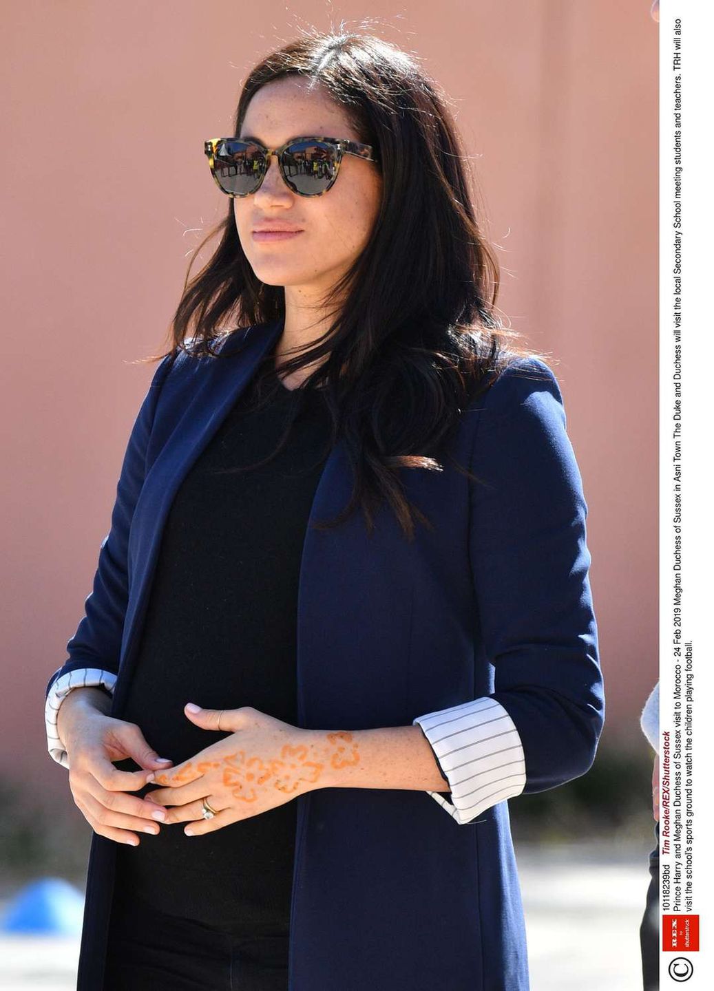 Mandatory Credit: Photo by Tim Rooke/REX/Shutterstock (10118239bd)  Meghan Duchess of Sussex in Asni Town  Prince Harry and Meghan Duchess of Sussex visit to Morocco - 24 Feb 2019  The Duke and Duchess will visit the local Secondary School meeting students and teachers. TRH will also visit the school's sports ground to watch the children playing football.