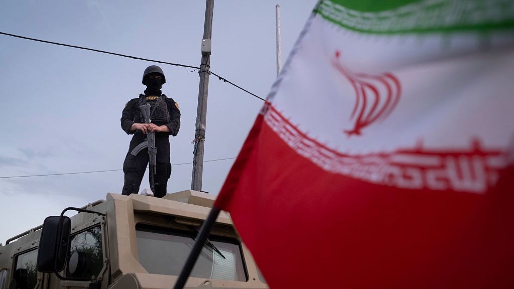 Iran-Religious Rally Amid Ceasefire
An armed Iranian police officer stands guard on an armored vehicle, monitoring the area during a state-run religious rally in downtown Tehran, Iran, on April 29, 2026, as a ceasefire is extended. (Photo by Morteza Nikoubazl/NurPhoto via Getty Images)
NurPhoto
iran-u.s.-negotiations, iran-u.s.-relations, direct-negotiations, direct talks, islamic-revolutionary-guard-corps, fragile-ceasefire, quds-force, proxy-forces, irgc, full body, defence