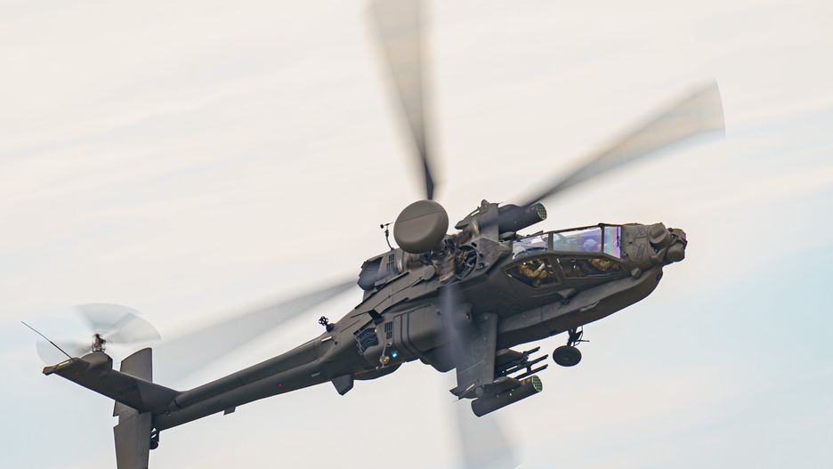 The Army Air Corps latest Apache AH-64E attack helicopter performs maneuvers over open countryside at the Army Aviation Centre at Middle Wallop, Stockbridge in Hampshire. Picture date: Tuesday July 12, 2022. (Photo by Ben Birchall/PA Images via Getty Images)