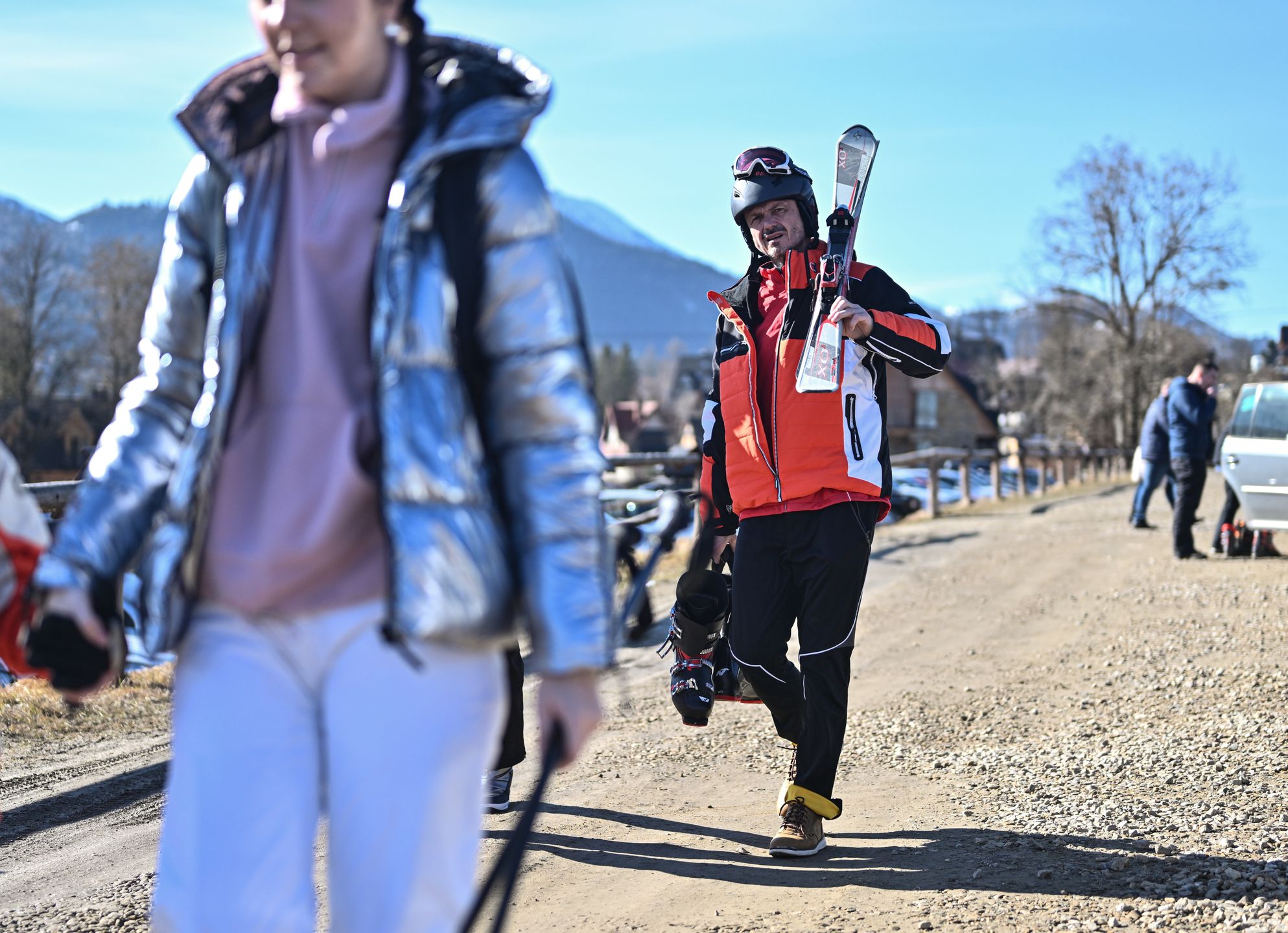 ZAKOPANE, POLAND - FEBRUARY 16: People get ready to practice on a ski sloop operating with a small amount of snow during an unusually high-temperature day in Zakopane, Poland on February 16, 2024. Poland is now having unusually warm temperatures, during a time, when Zakopane is full of snow and negative temperatures. All snow has melted during the past few days and one of the main attractions, the snow maze is melting and a reduced price has been introduced by the organizers. According to the European Union's Copernicus Climate Change Service, the period between February 2023 and January 2024 is the hottest 12-month period ever measured. During this time, global average temperatures rose 1.52 degrees Celsius. The 1.5 Celcius degrees boundary stands out because it was a limit established as part of the 2015 Paris climate agreement. (Photo by Omar Marques/Anadolu via Getty Images)