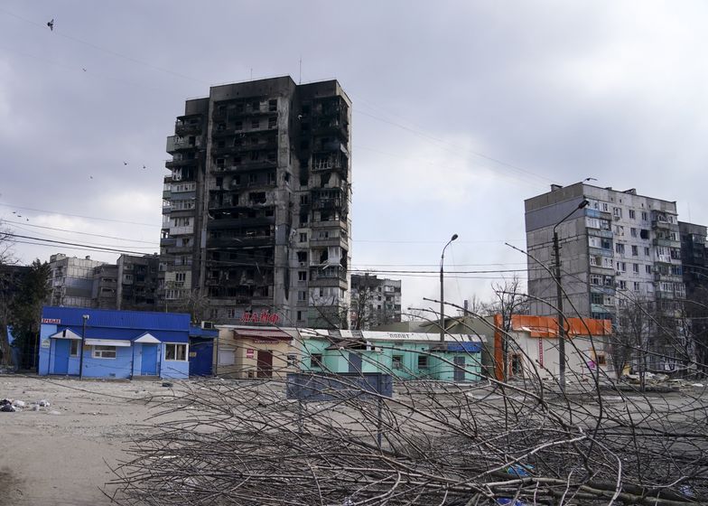 MARIUPOL, UKRAINE - MARCH 18: Destroyed buildings are seen as civilians trapped in Mariupol city under Russian attacks, are evacuated in groups under the control of pro-Russian separatists, through other cities, in Mariupol, Ukraine on March 18, 2022. (Photo by Stringer/Anadolu Agency via Getty Images)