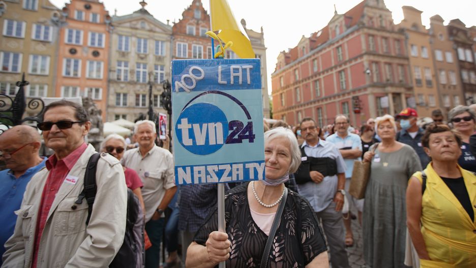 Protesters holding anti-government banners and TVN and TVN 24 tv stations logos are seen in Gdansk, Poland on 10 August 2021 People across the country protest on streets to defend media freedom in Poland and counter the serious attack on the independence of the countrys largest private television channel, TVN, by the ruling Law and Justice (PiS) party (Photo by Michal Fludra/NurPhoto via Getty Images)