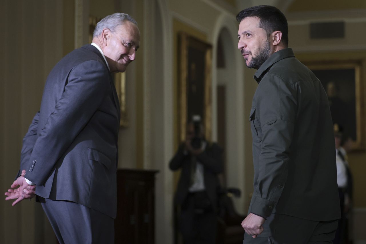 WASHINGTON, DC - SEPTEMBER 21: U.S. Senate Majority Leader Chuck Schumer (L) (D-NY) walks with President of Ukraine Volodymyr Zelensky at the U.S. Capitol Building on September 21, 2023 in Washington, DC. Schumer said that Zelensky told him, "if we don’t get the aid, we will lose the war." (Photo by Win McNamee/Getty Images)