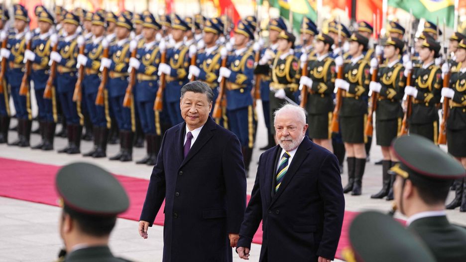 Temporary
Chinese President Xi Jinping (L) and Brazil's President Luiz Inacio Lula da Silva attend a welcome ceremony at the Great Hall of the People in Beijing on April 14, 2023. (Photo by Ken Ishii / POOL / AFP)
KEN ISHII