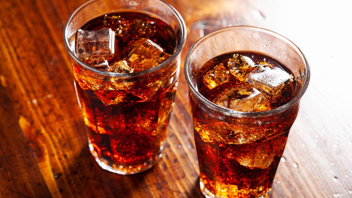 glass of cold cola soft drink with ice on wooden background
glass of cold cola soft drink with ice on wooden background
OlgaMiltsova