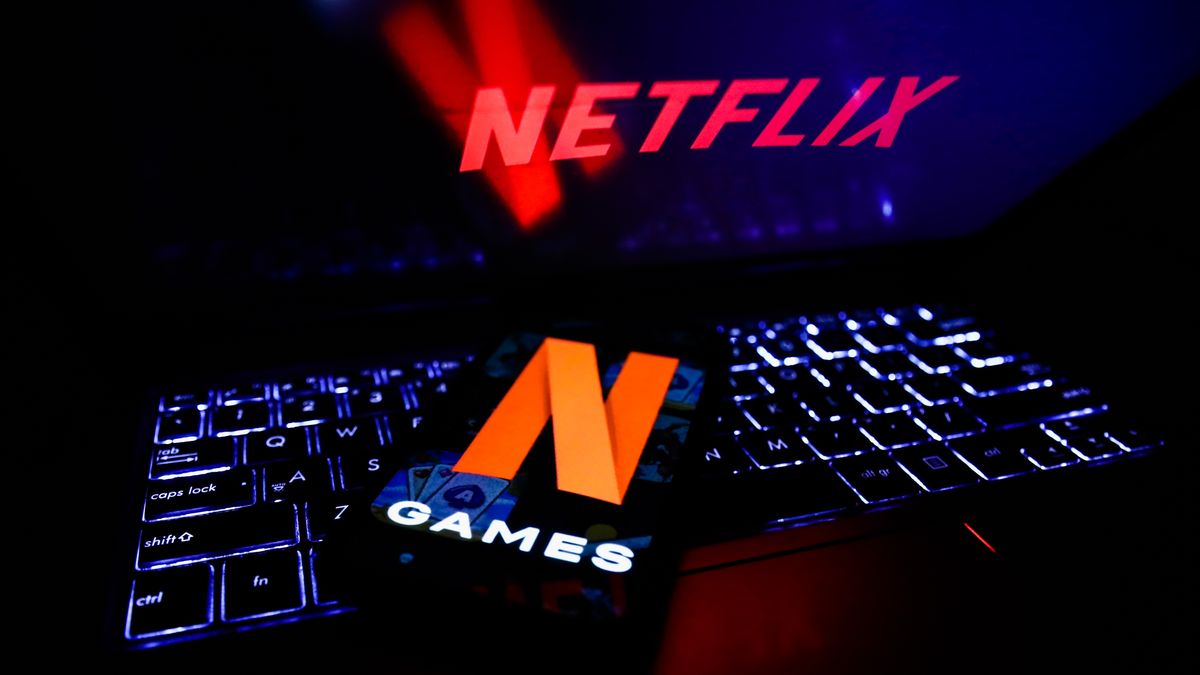 Netflix Games logo displayed on a phone screen and Netflix logo displayed on a laptop screen are seen in this illustration photo taken in Poland on November 4, 2021. (Photo by Jakub Porzycki/NurPhoto via Getty Images)