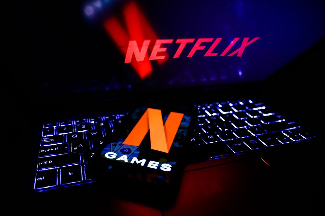 Netflix Games logo displayed on a phone screen and Netflix logo displayed on a laptop screen are seen in this illustration photo taken in Poland on November 4, 2021. (Photo by Jakub Porzycki/NurPhoto via Getty Images)