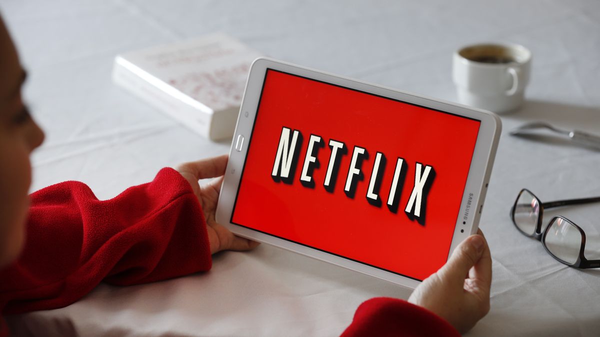 PARIS, FRANCE - NOVEMBER 20: PARIS, FRANCE - NOVEMBER 20: In this photo illustration, the Netflix media service provider's logo is displayed on the screen of a tablet on November 20, 2019 in Paris, France. Netflix, the US giant of online video subscription, has more than 5 million subscribers in France, 4 and a half years after its arrival in France in September 2014. Netflix offers movies and TV series over the internet and now has 137 million subscribers worldwide. (Photo by Chesnot/Getty Images)