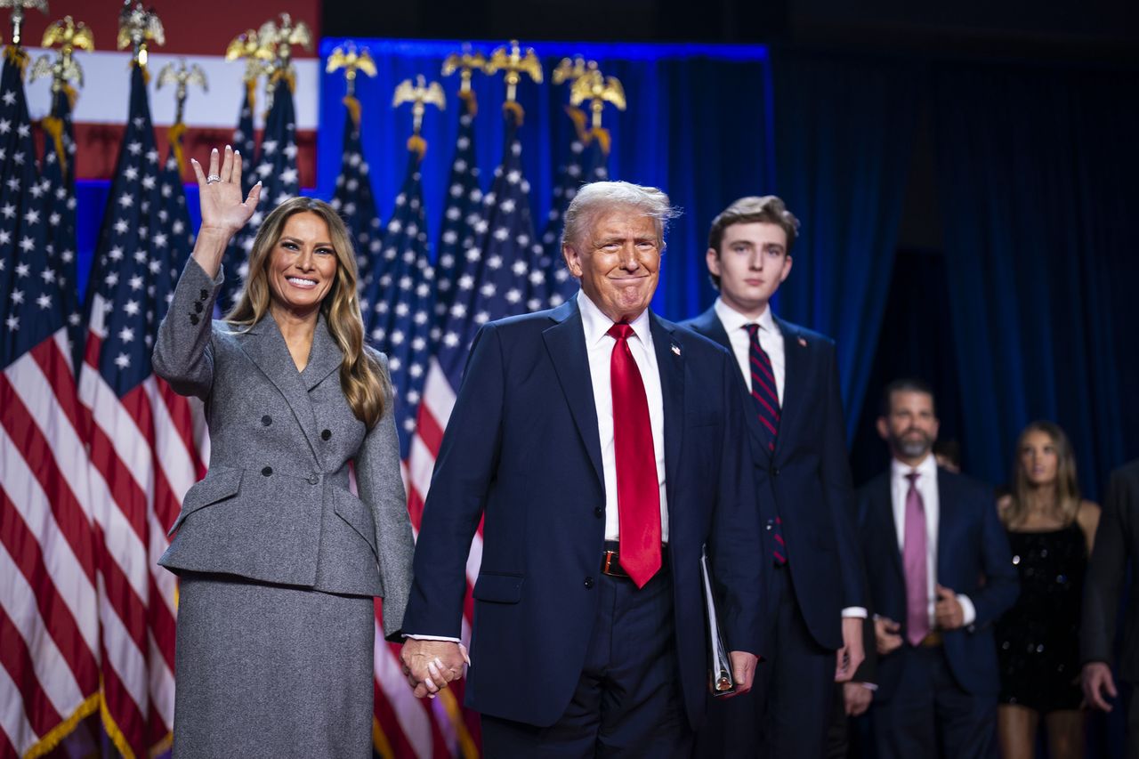 West Palm Beach, FL - November 6 : Republican presidential nominee former President Donald Trump walks out on stage with his wife Melania after being declared the winner during an election night watch party at the Palm Beach County Convention Center in West Palm Beach, Florida in the early hours of Wednesday, Nov. 06, 2024. (Photo by Jabin Botsford/The Washington Post via Getty Images)