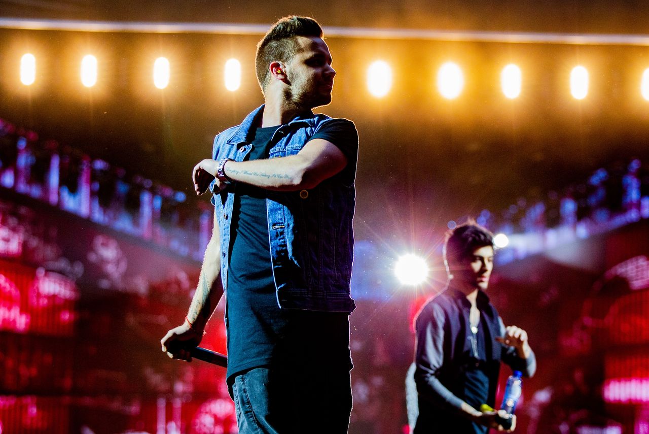 AMSTERDAM, NETHERLANDS - JUNE 24: Liam Payne of One Direction performs live on stage at Amsterdam Arena on June 24, 2014 in Amsterdam, Netherlands. (Photo by Paul Bergen/Redferns)